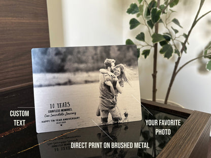 Metal photo plaque with a couple embracing and text on an aluminum surface 