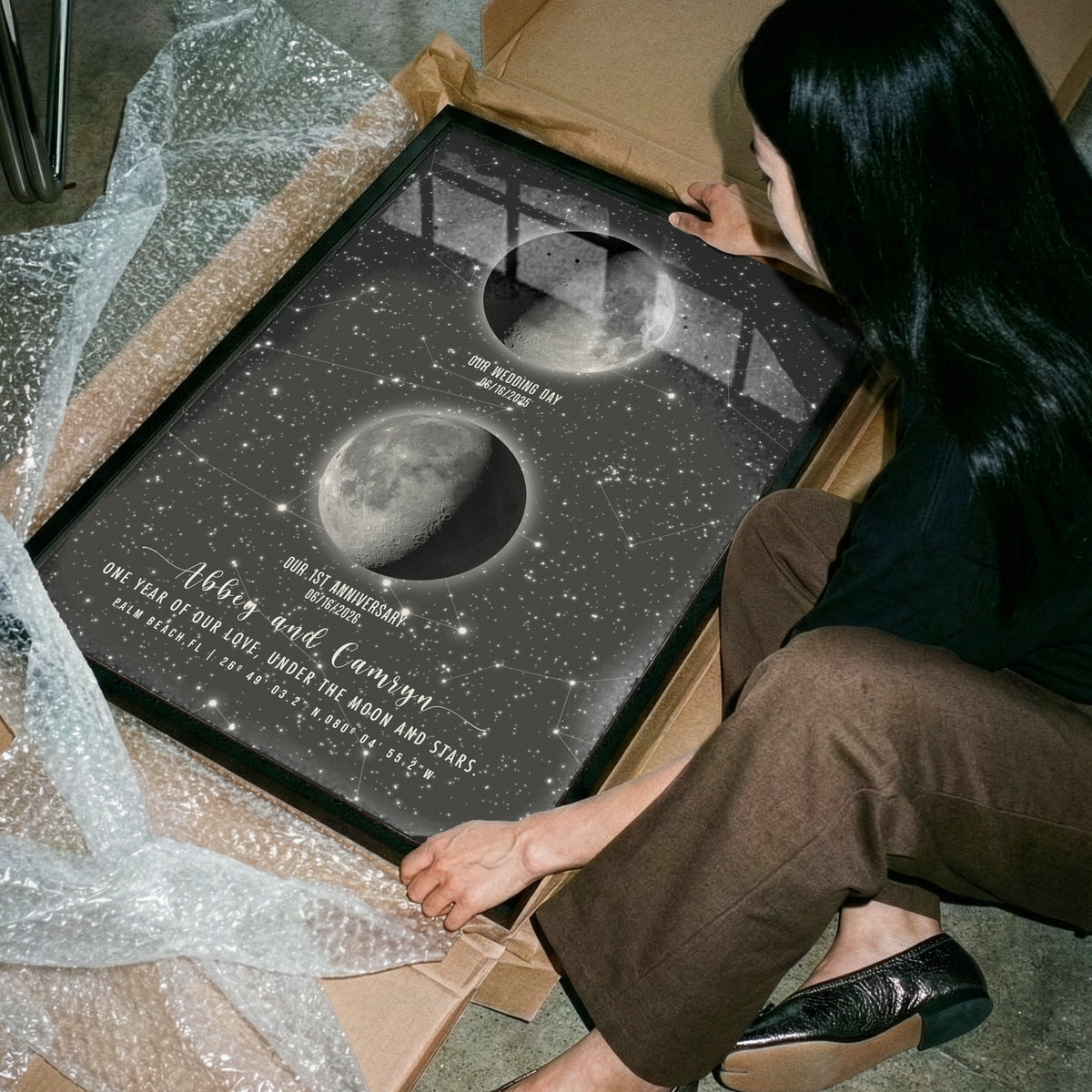1st anniversary night sky print on paper with moon ohases and personalized names in a frame
